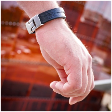 Black leather bracelet with silver tone clasp